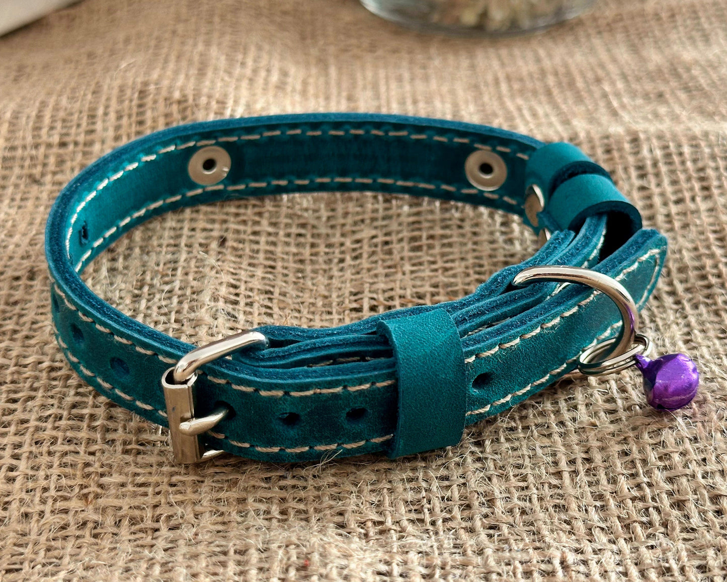 Unique personalized cat collar with soft leather and durable metal hardware.