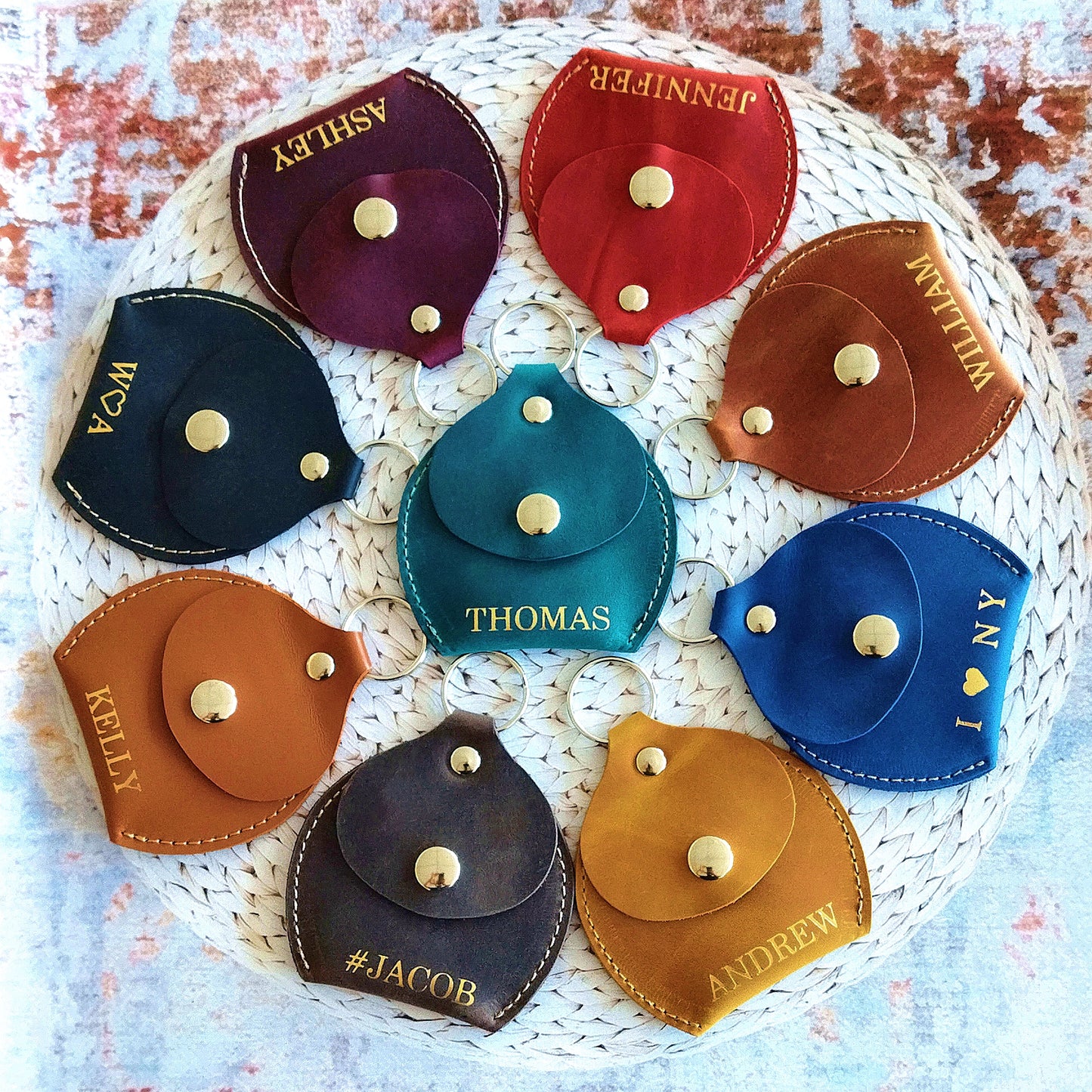 Custom leather coin pouch next to matching leather purse, demonstrating a stylish accessory set