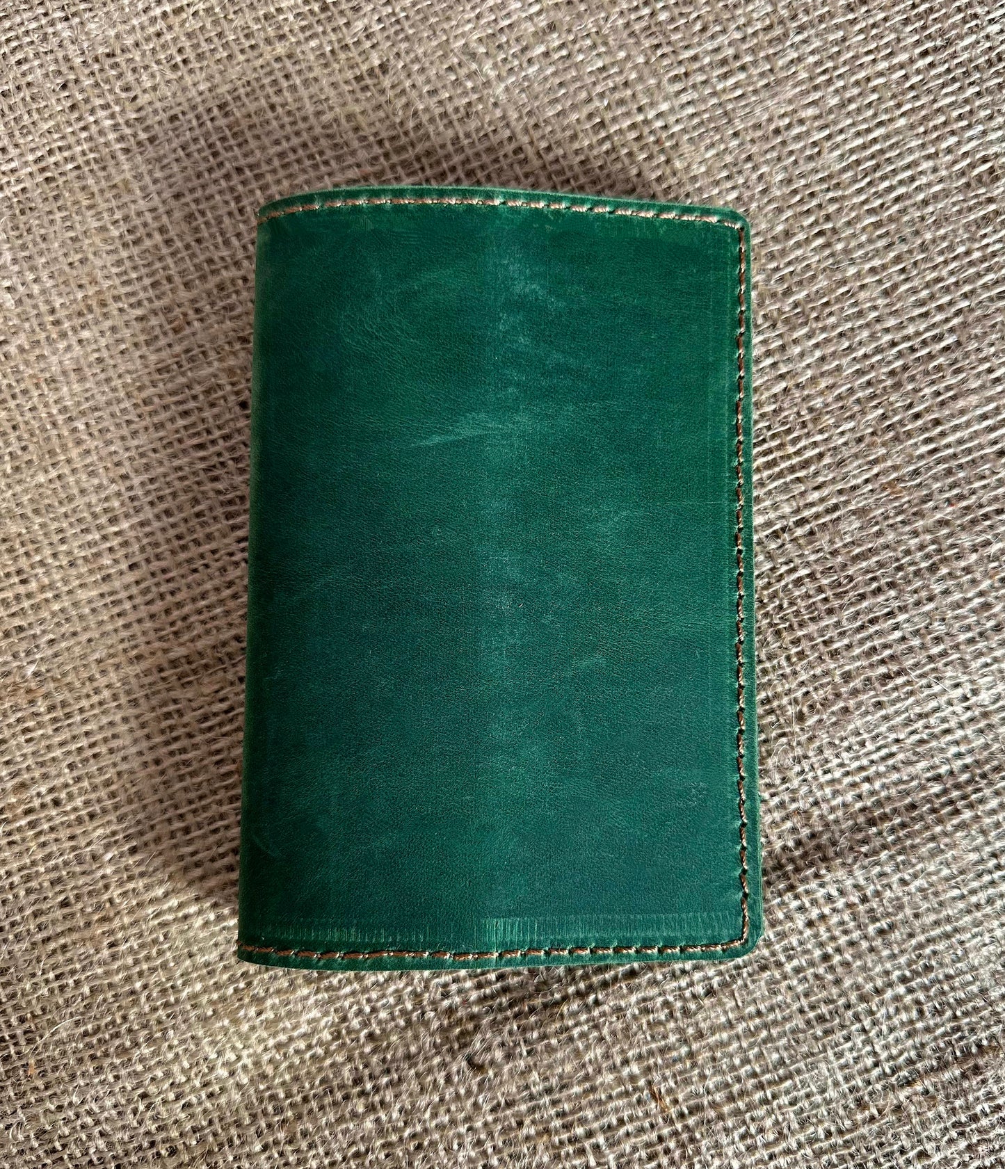 Close-up of stitching on leather passport cover