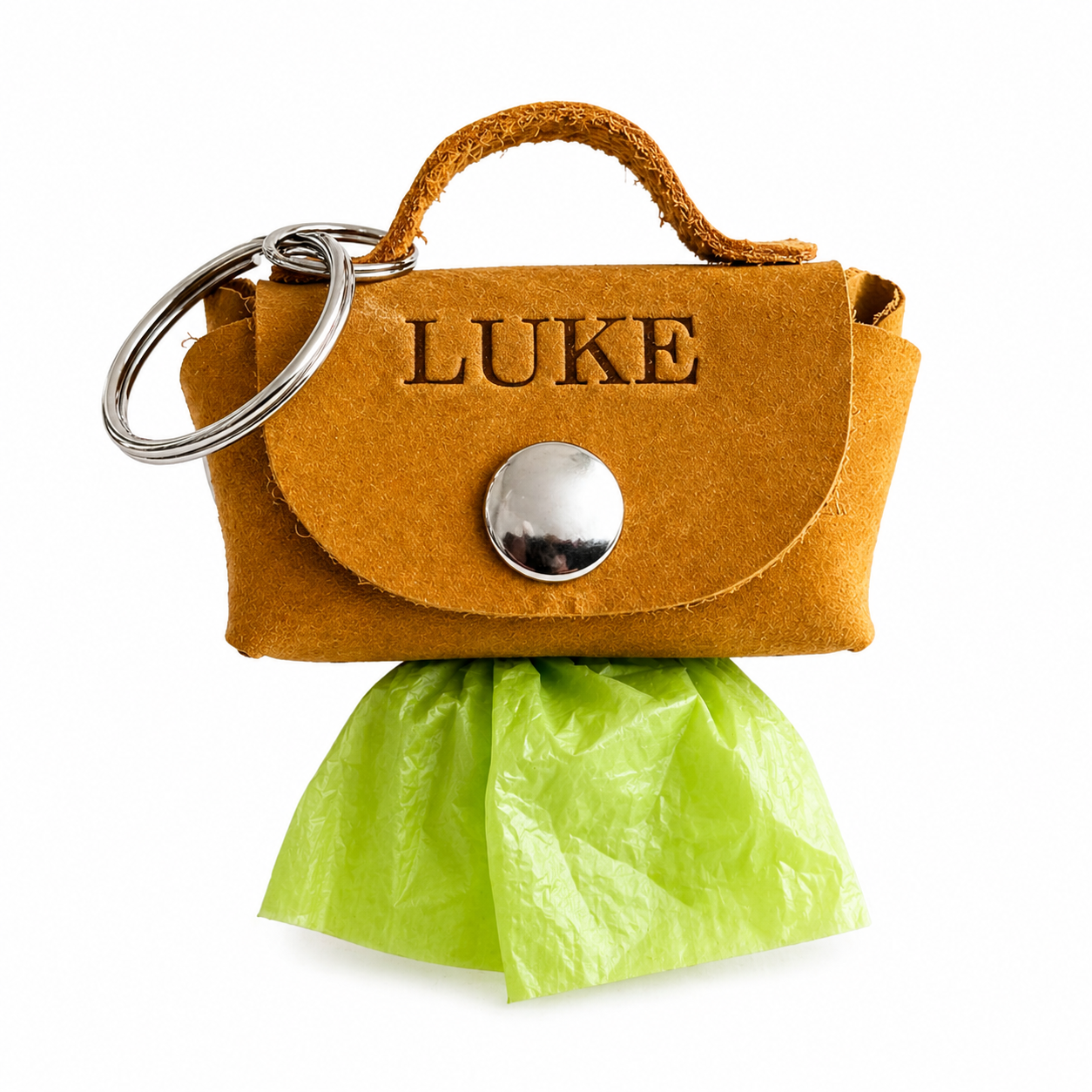 Brown leather keychain with 'LUKE' engraving and green plastic bag on a white background