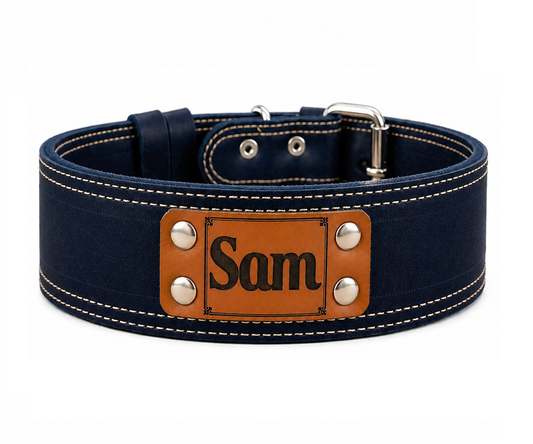 Navy blue dog collar with a brown leather patch displaying 'Sam' on a white background