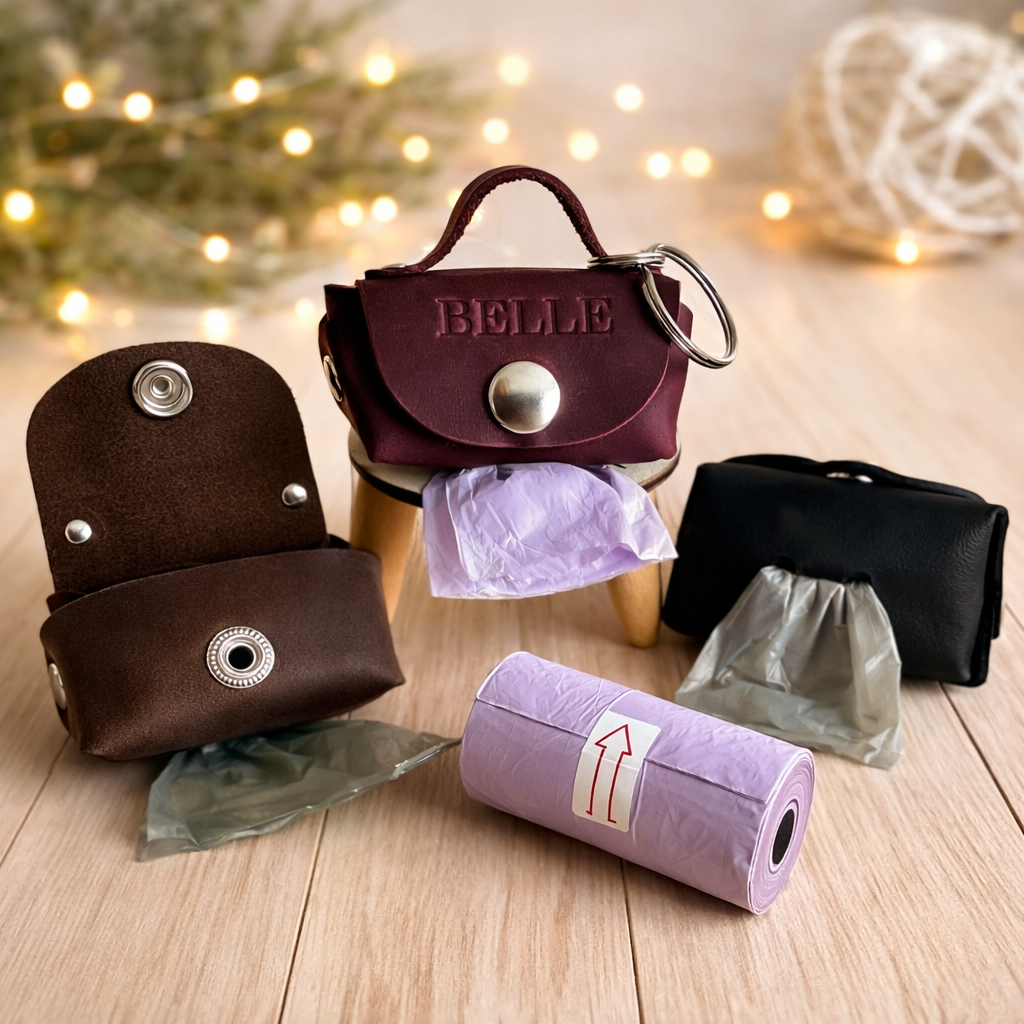 Set of small bags and a roll of paper on a wooden surface with decorative lights in the background