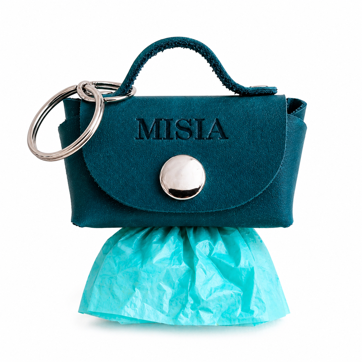 Teal handbag-shaped keychain with 'MISIA' branding on a white background