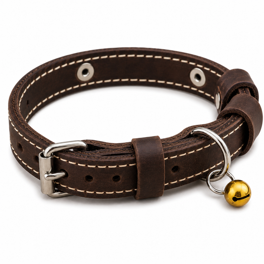 Brown leather dog collar with a gold bell on a white background