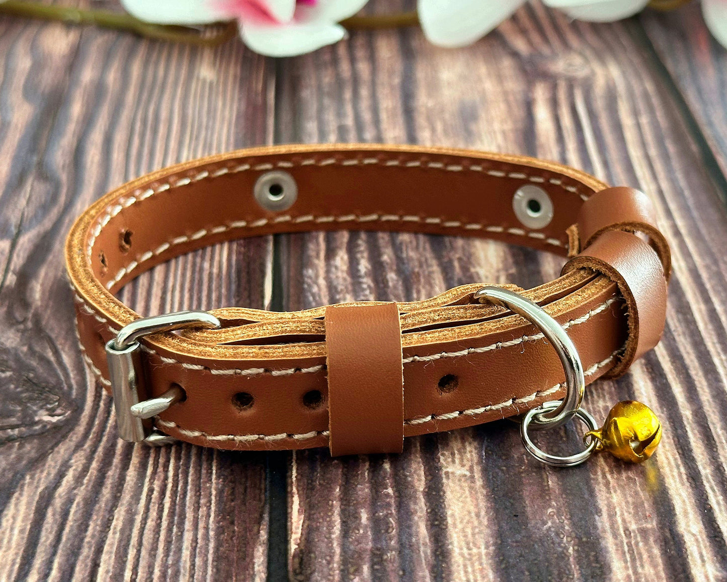 Soft leather kitten collar with strong stitching and a customizable ID tag.