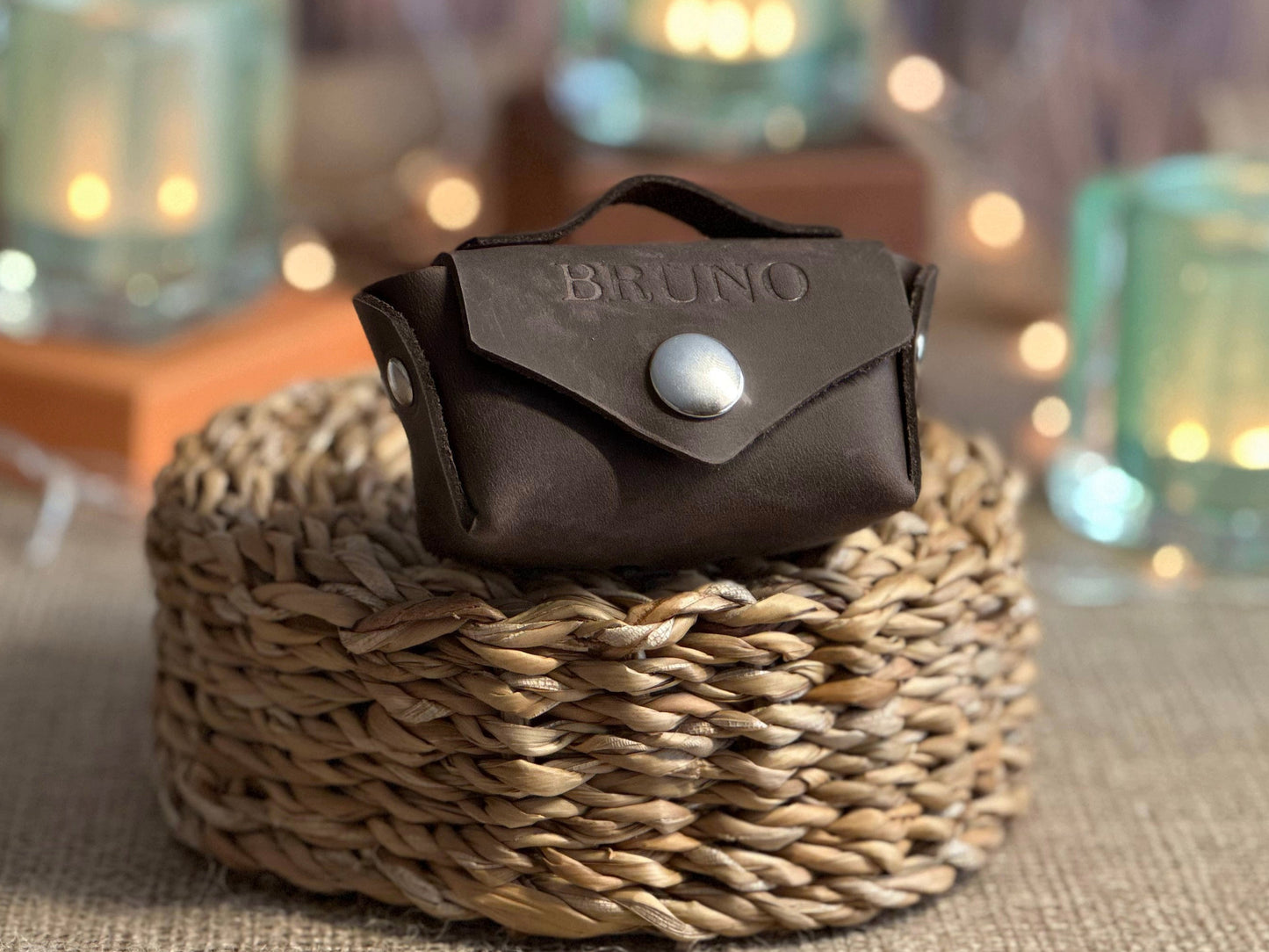 Compact leather poop bag holder designed to fit standard poop bags and small dog essentials