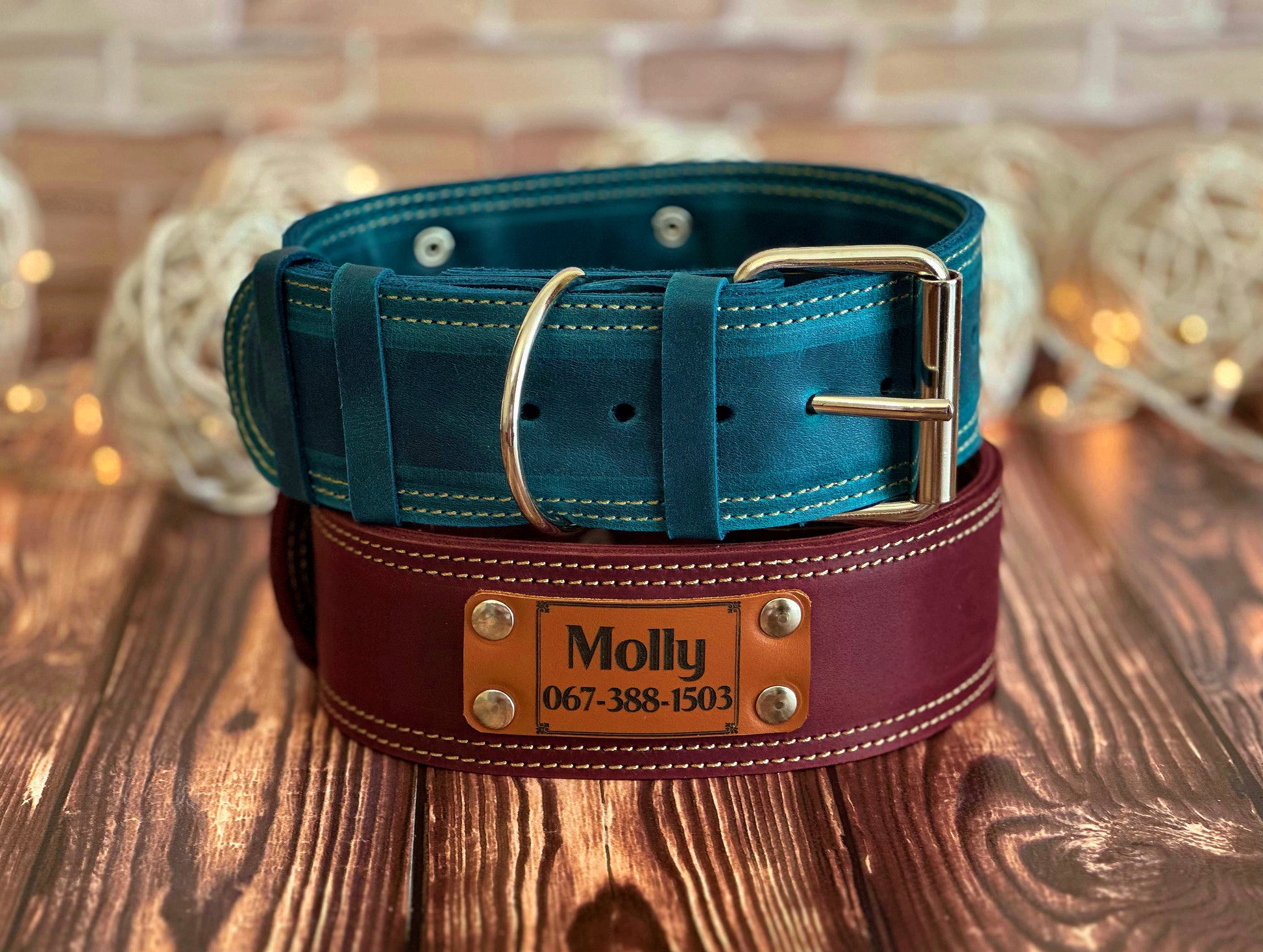 Custom 2-inch wide leather dog collars with name engraving, designed for durability and a secure fit.