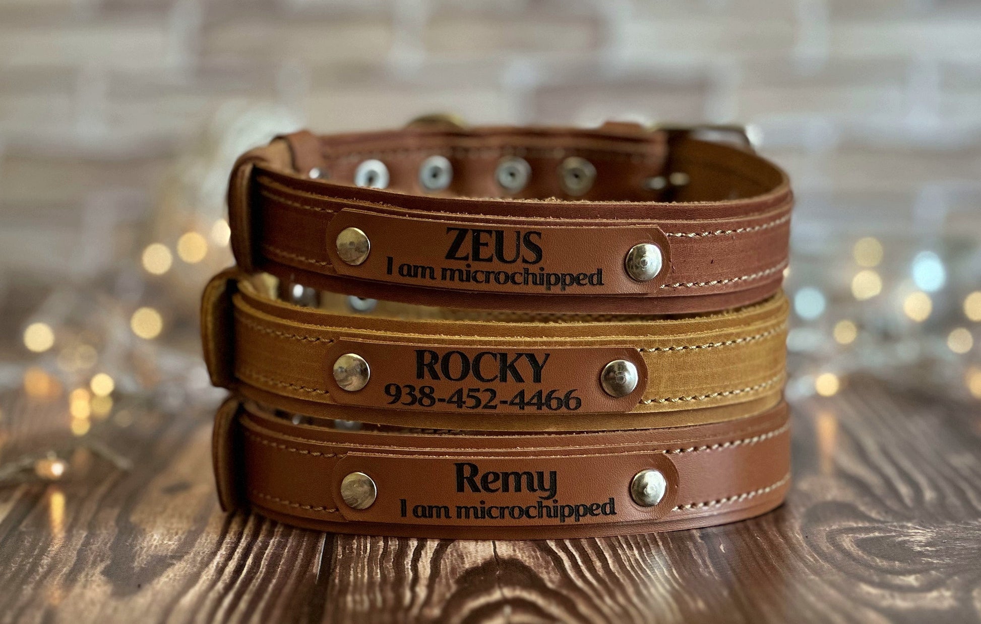 Thin brown leather collar with engraved tag for dogs