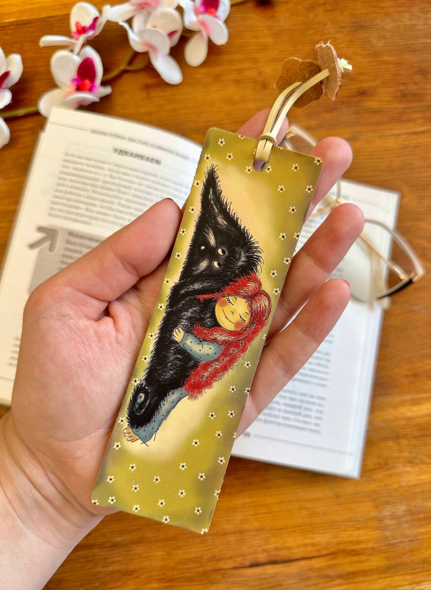 Detailed view of the handcrafted leather bookmark, emphasizing the intricate floral pattern and premium quality