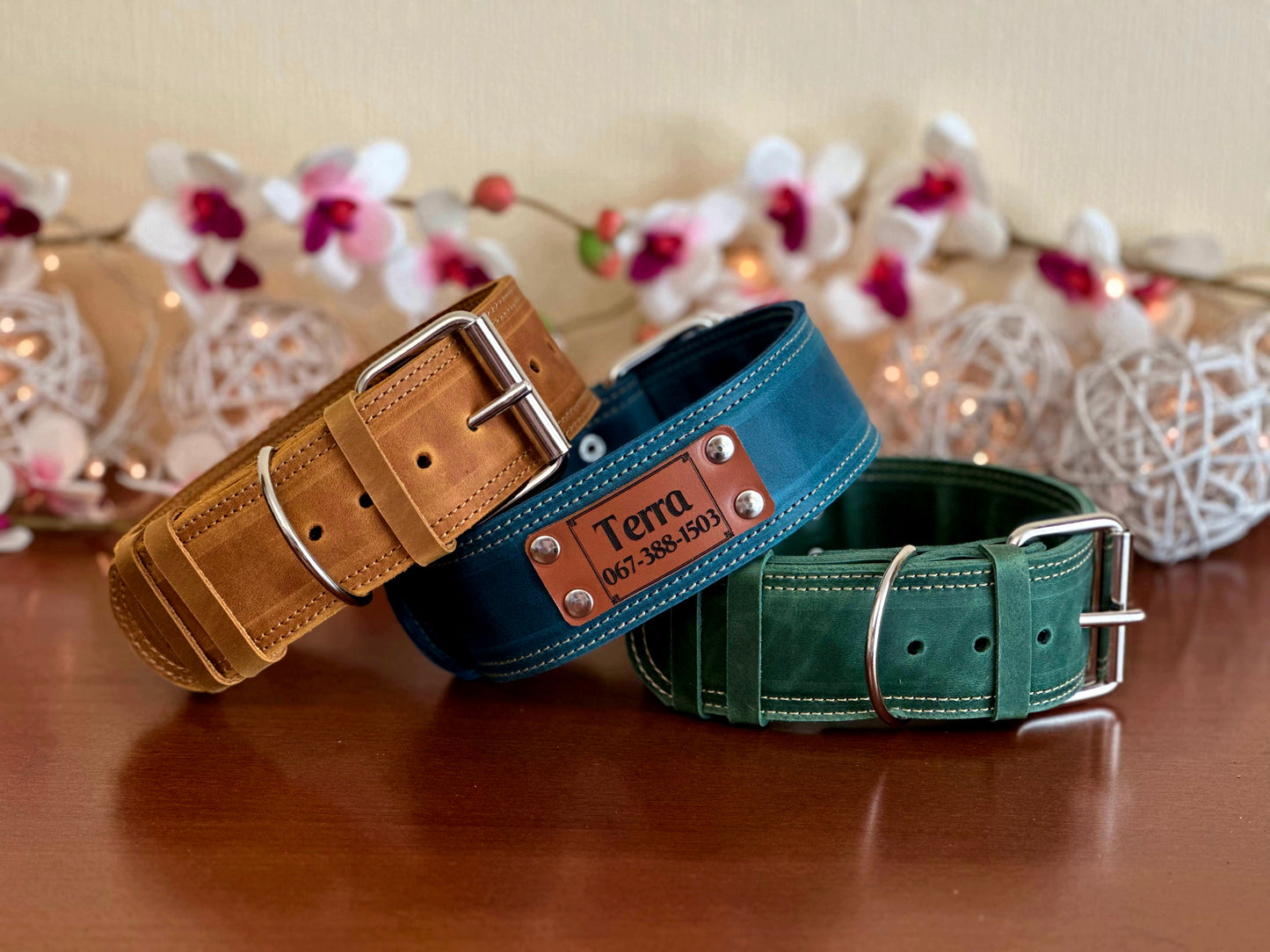 Heavy wide 2-inch leather dog collar with reinforced stitching and personalized engraving for added security.