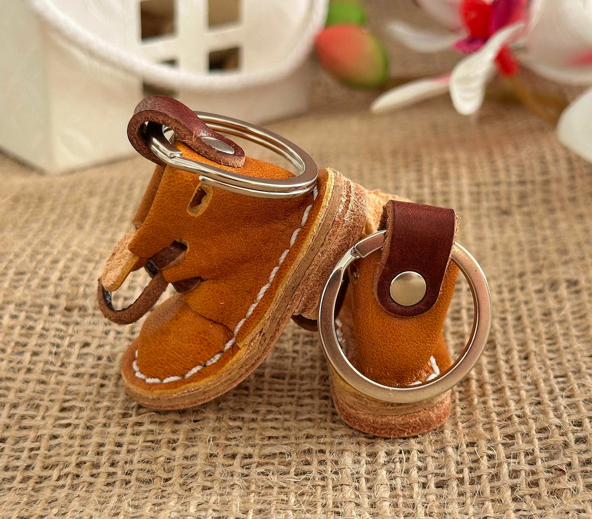 A leather boot keychain accessory that makes a great addition to bags, backpacks, or keychains