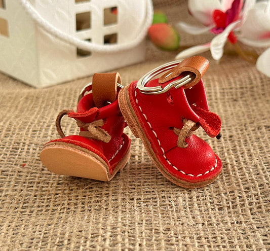Leather boot keychain with boho fringe details for a stylish, carefree look