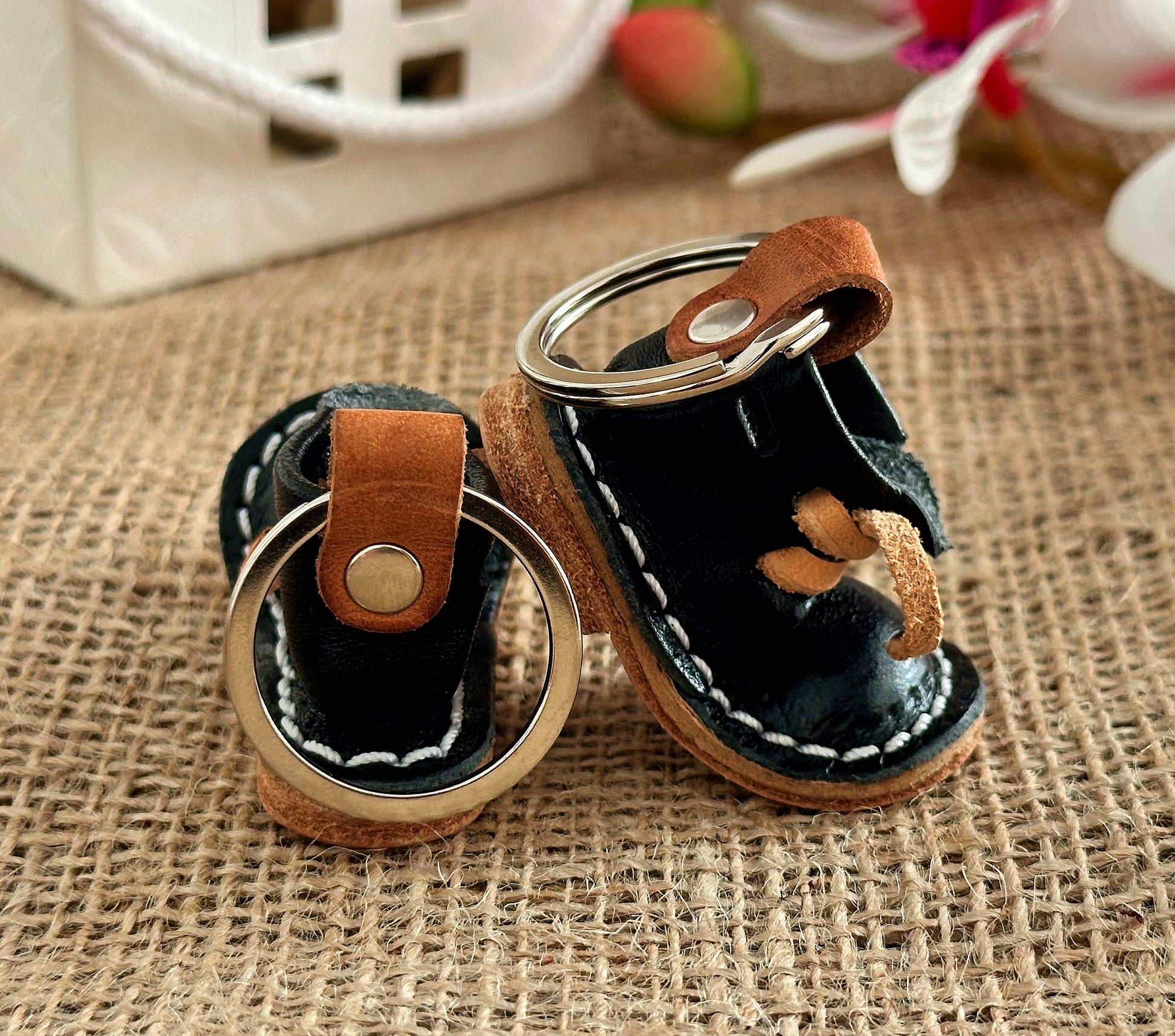 Close-up view of the detailed stitching on the leather boot keychain, highlighting the craftsmanship
