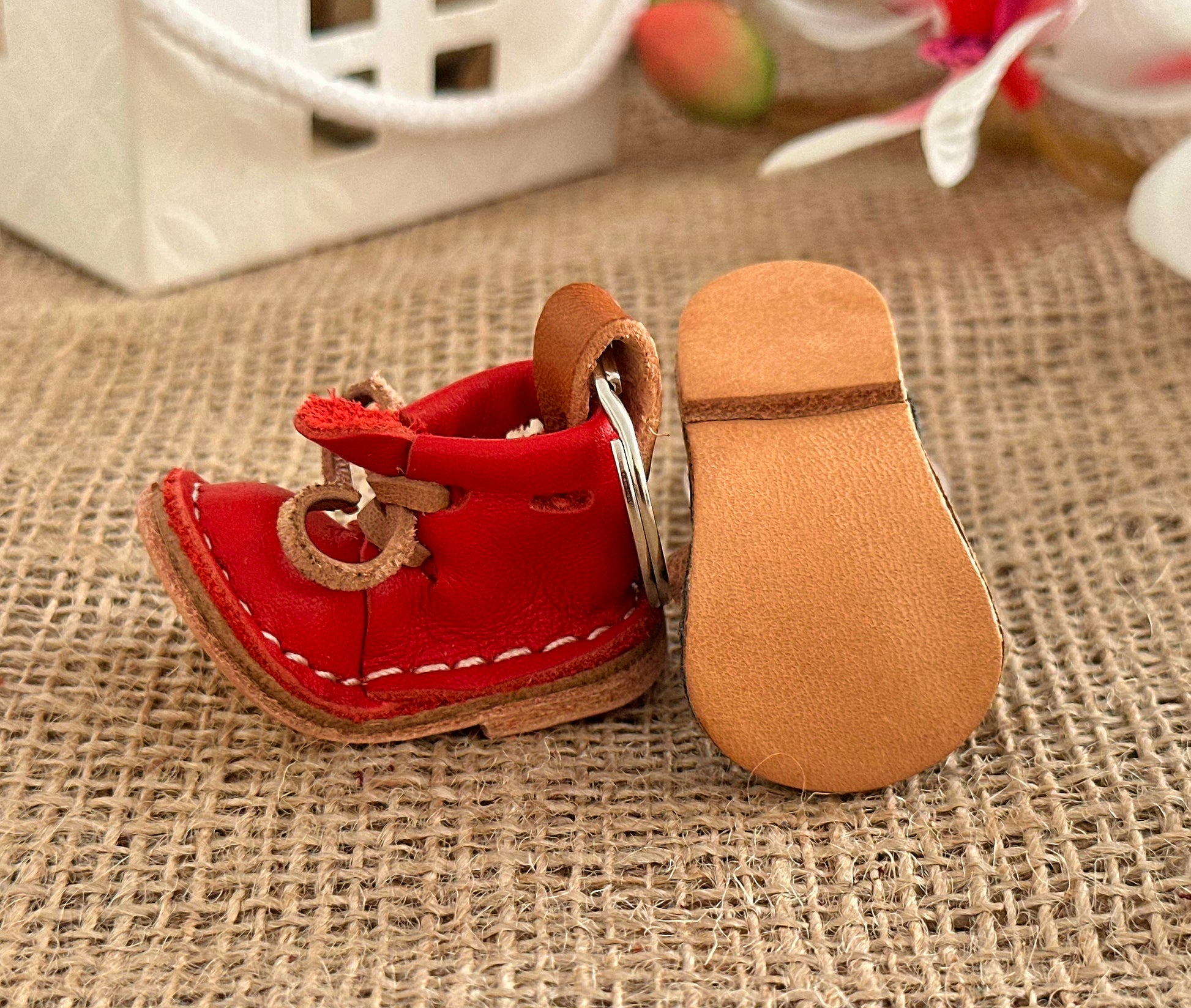 Leather boot keychain with gold accents for a touch of elegance and luxury