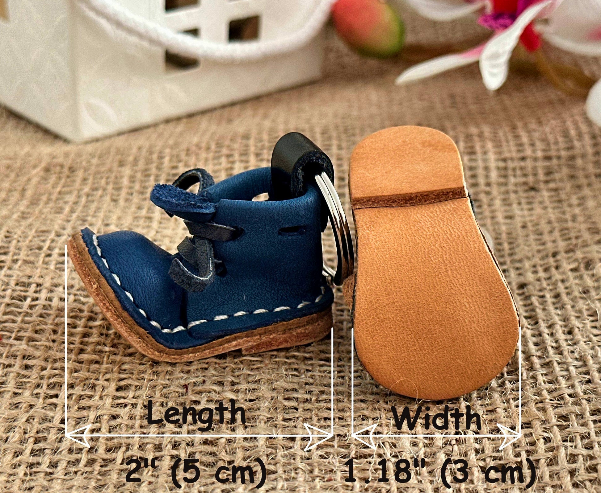 Leather boot keychain with a sturdy keyring attachment, designed for easy carrying