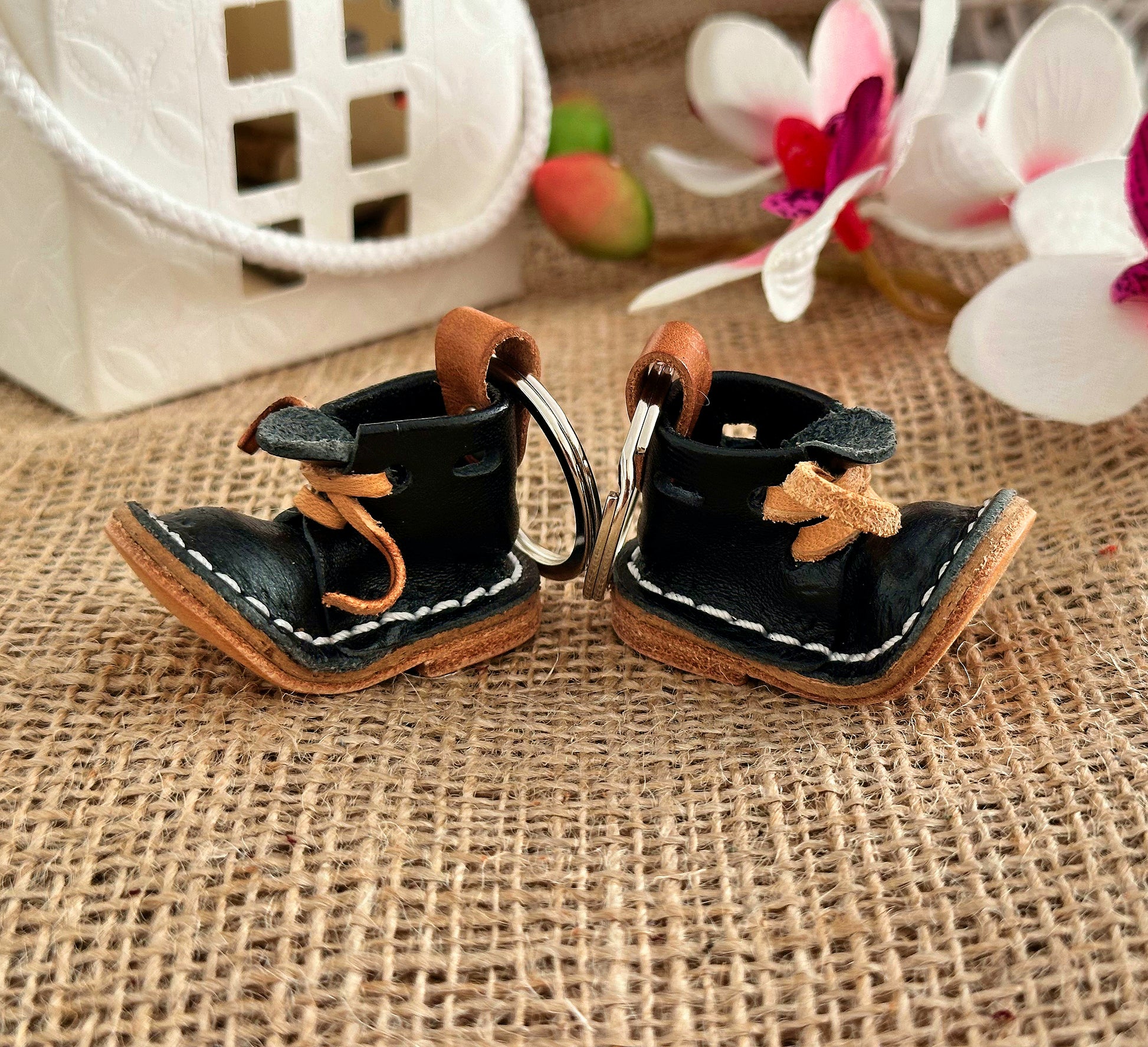 Example of custom engraving on a leather boot keychain, showcasing personalized text for a unique gift