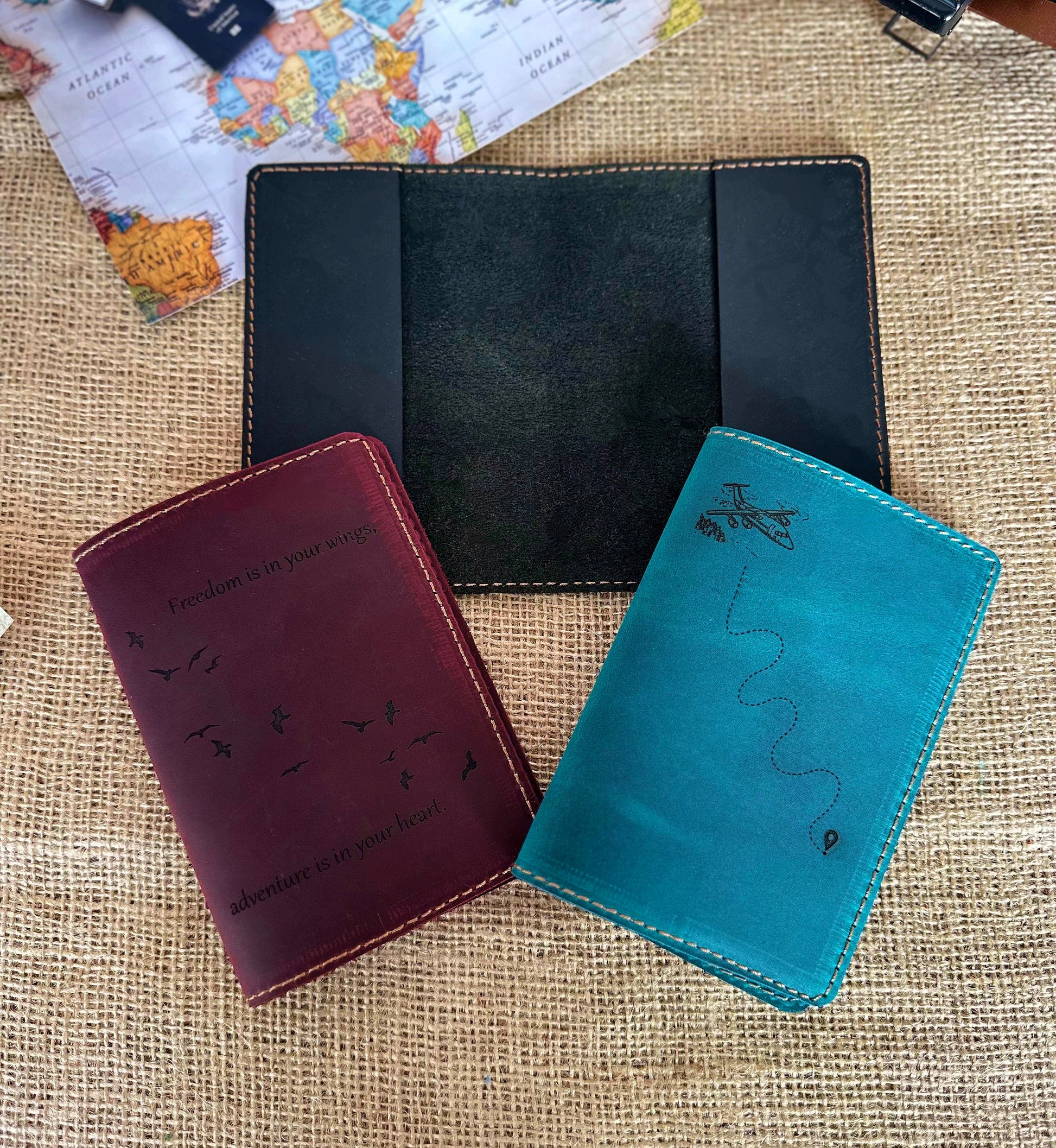 Styled shot of leather passport wallet with accessories