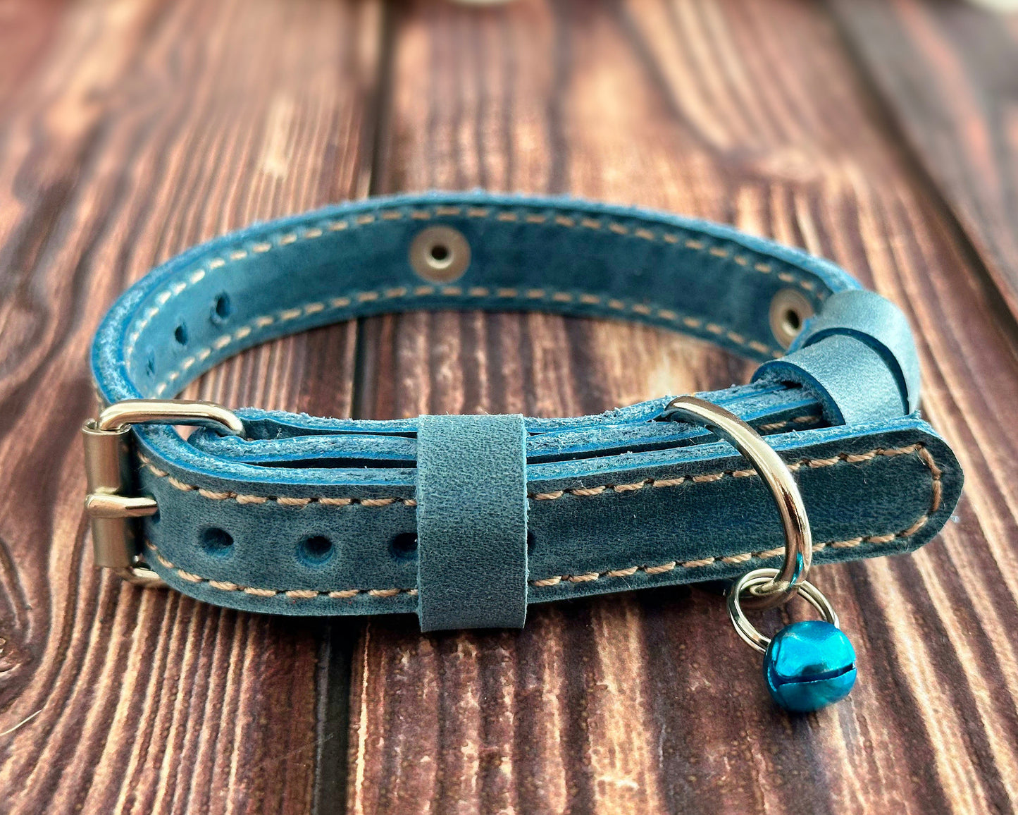 Breakaway leather cat collar with a personalized name tag, safe and stylish.