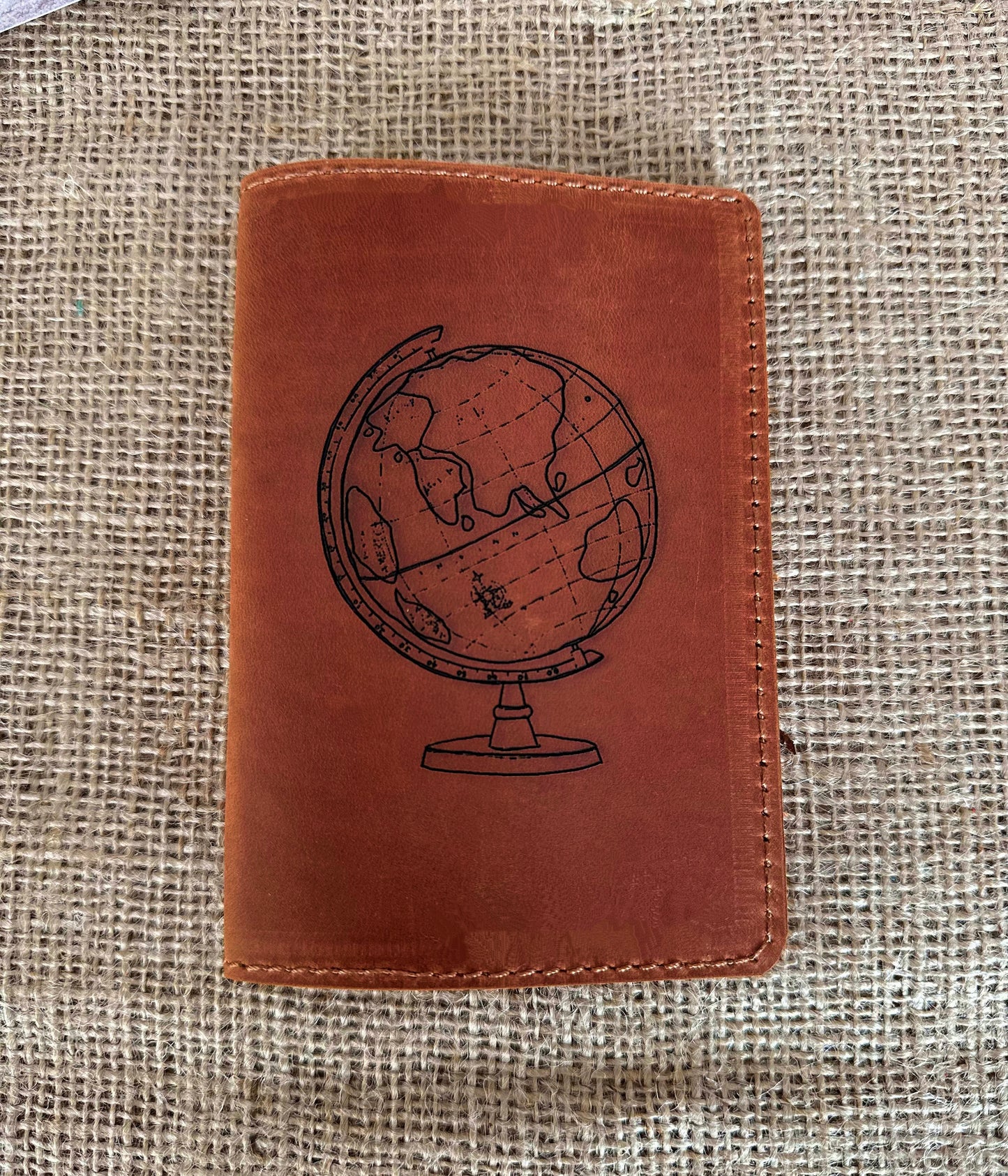 Passport cover opened with passport and travel documents inside