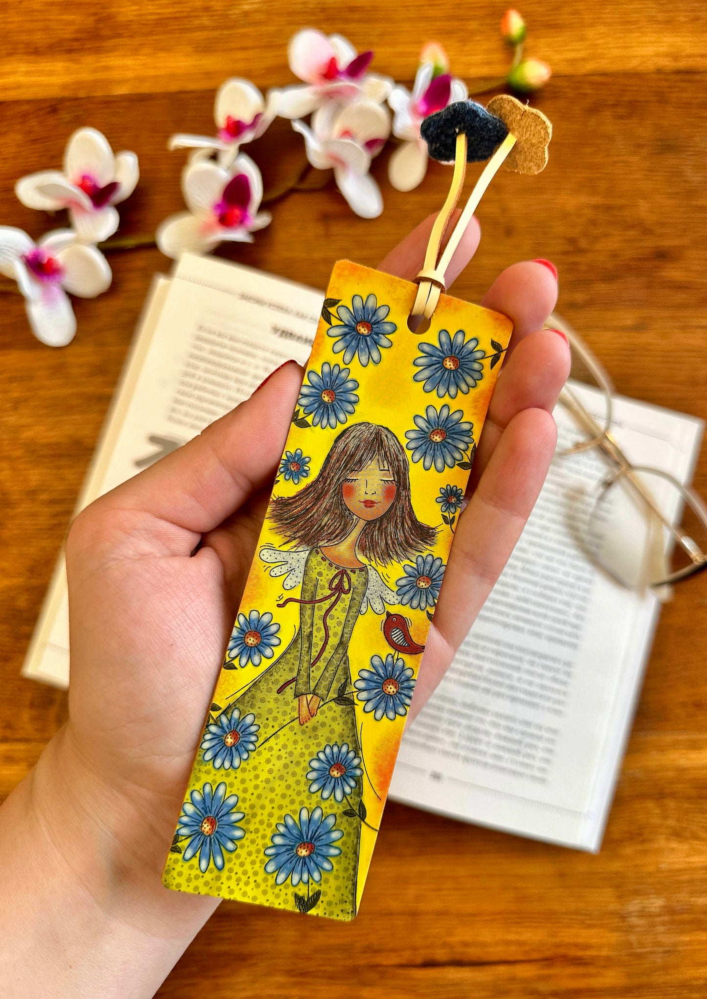 Customized leather bookmark with a floral pattern and personalized engraving, perfect for gifting or personal use