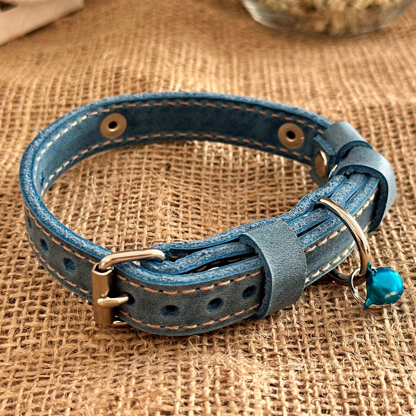 Lightweight leather cat collar with personalized engraving, perfect for small breeds.