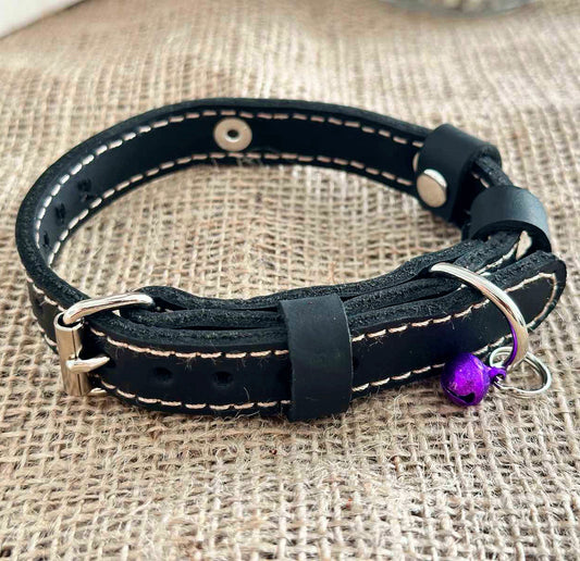 Durable leather cat collar with adjustable fit, engraved with a name or phone number.