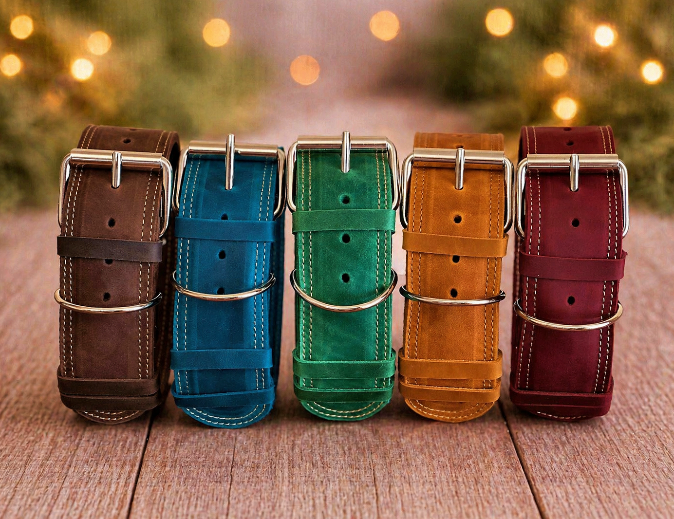 Five leather watch straps in brown, blue, green, orange, and red on a wooden surface with blurred lights in the background.