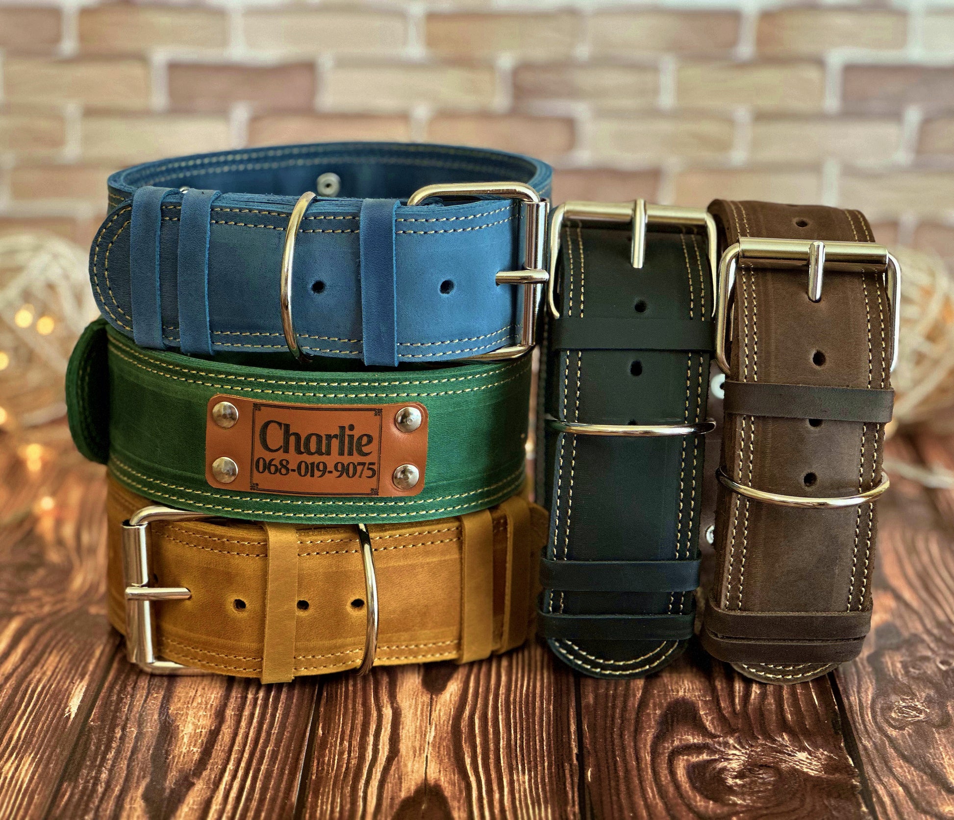Wide 2-inch heavy-duty custom leather dog collar with strong buckles and a personalized engraving for added style.